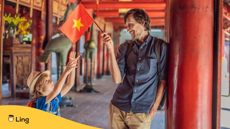 Man holding Vietnamese flag