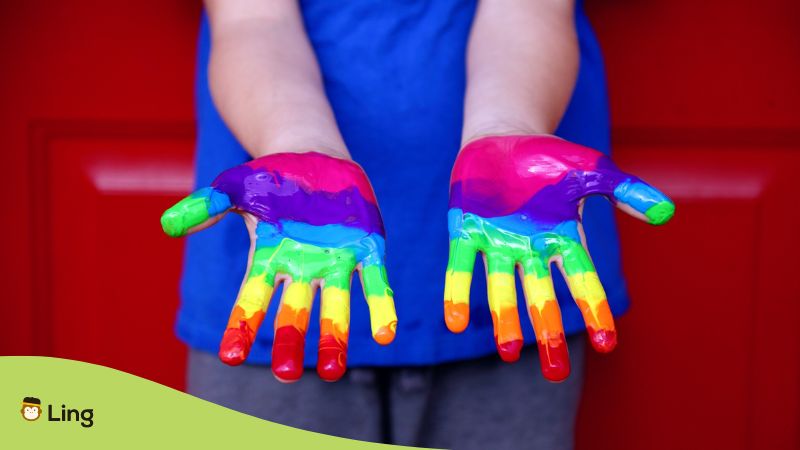 rainbow paint on hands LGBTQ pride