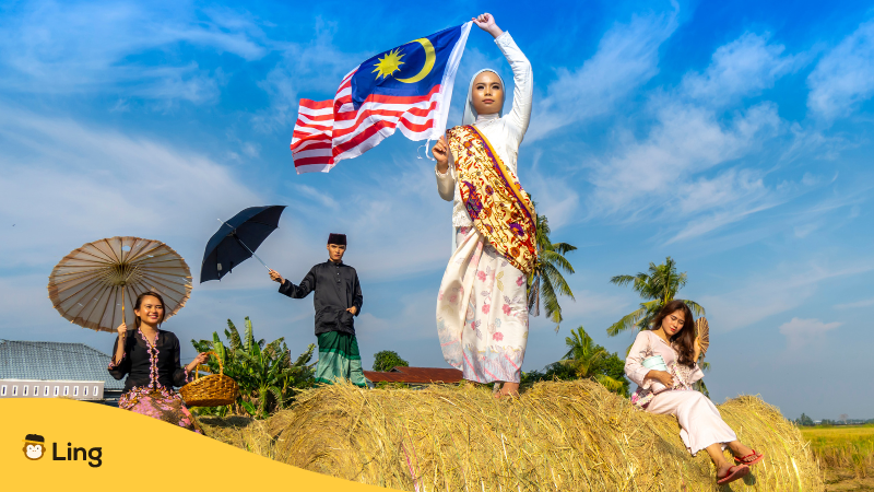 Malay-names-ling-app-Malay-holding-Malaysian-flag - ling-app.com