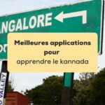 applications pour apprendre le kannada Panneau indiquant la direction de Bangalore écrit en lettres latines et en alphabet kannada