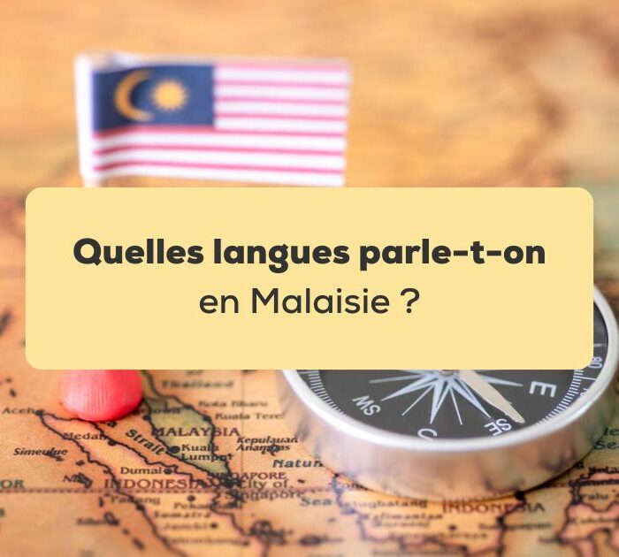 langues parlées en Malaisie Drapeau de la malaisie sur une carte de la Malaisie posé à côté d'une boussole noire