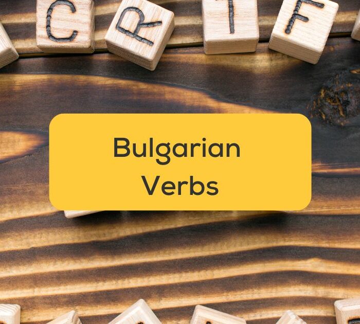 Wooden cubes with letters on wooden table