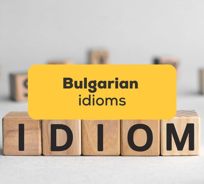 The word 'idiom' spelled with wooden blocks - Bulgarian idioms Ling app