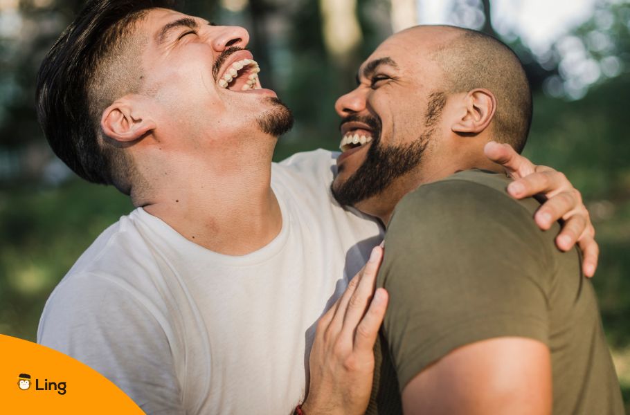 An Image Of Two Men Laughing