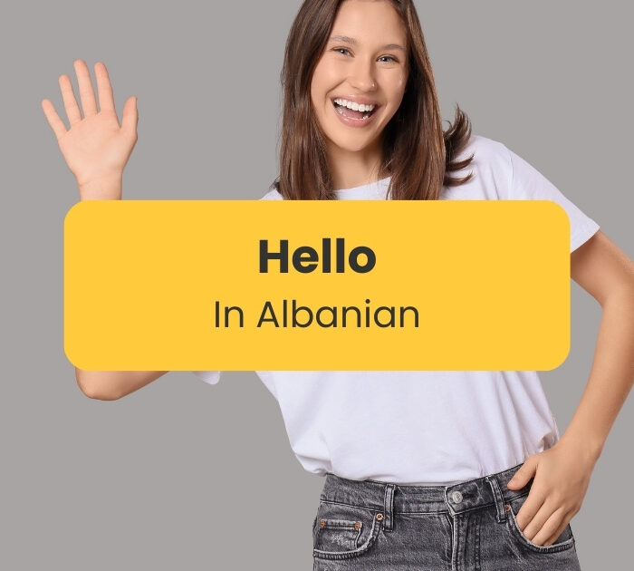 Hello in Albanian - Woman smiling and waving her hand