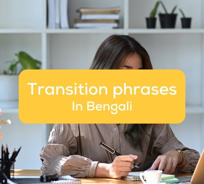 A woman studying with a laptop and a notebook - Transition phrases in Bengali