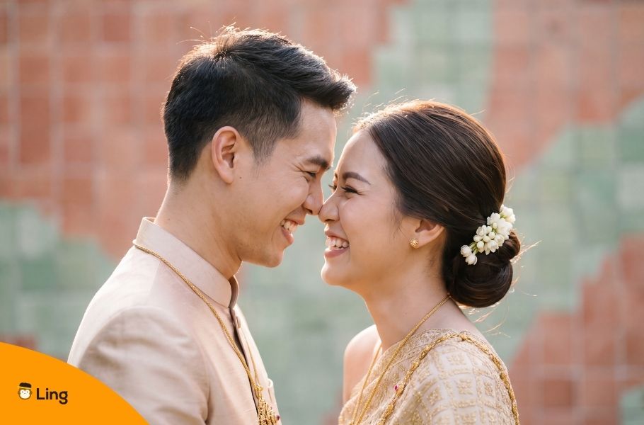 Happy Couple In Traditional Thai Wedding Attire
