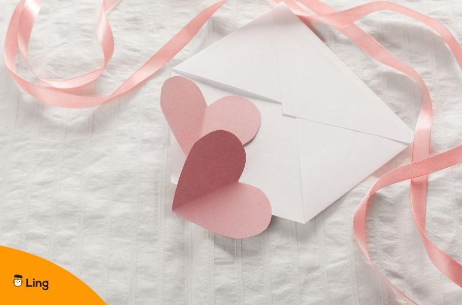 Envelope With Two Pink Paper Hearts And A Pink Ribbon