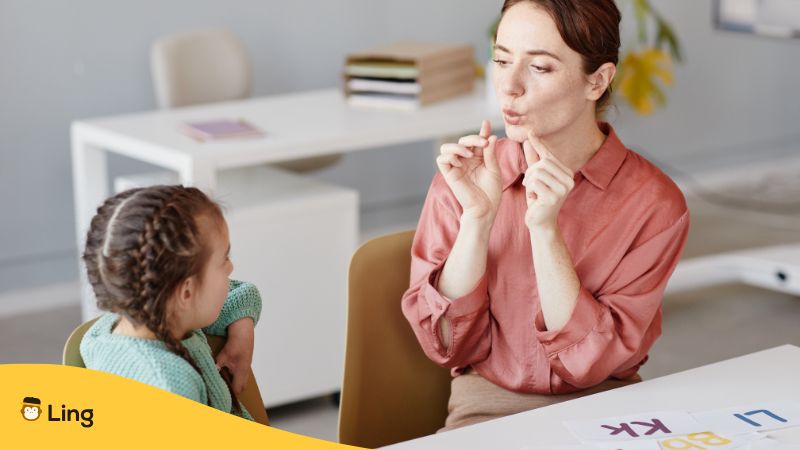 A Teacher Is Teaching Urdu Pronunciation To A Kid