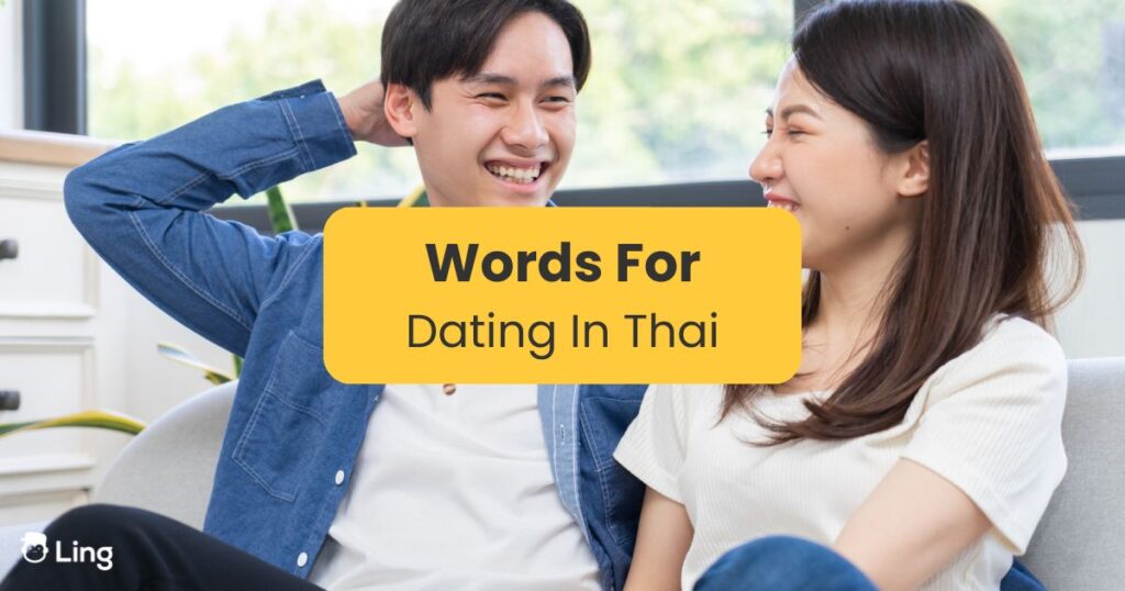 Chinese guy and his thai girlfriend laughing on the couch