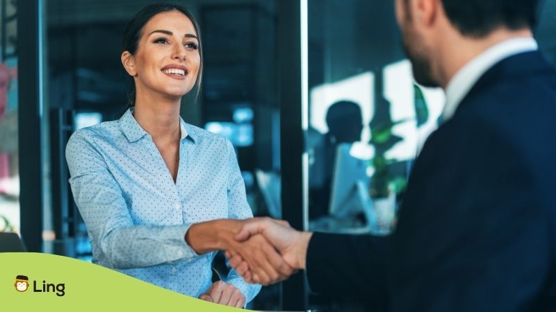 Businesswoman And Businessman Shaking Hands