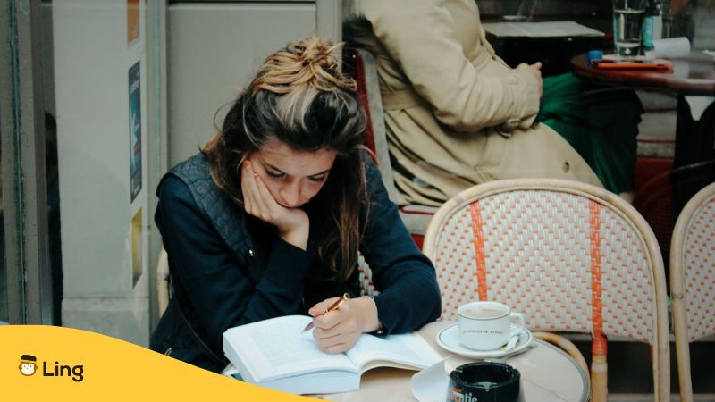 Girl Studying In A Coffee Shop