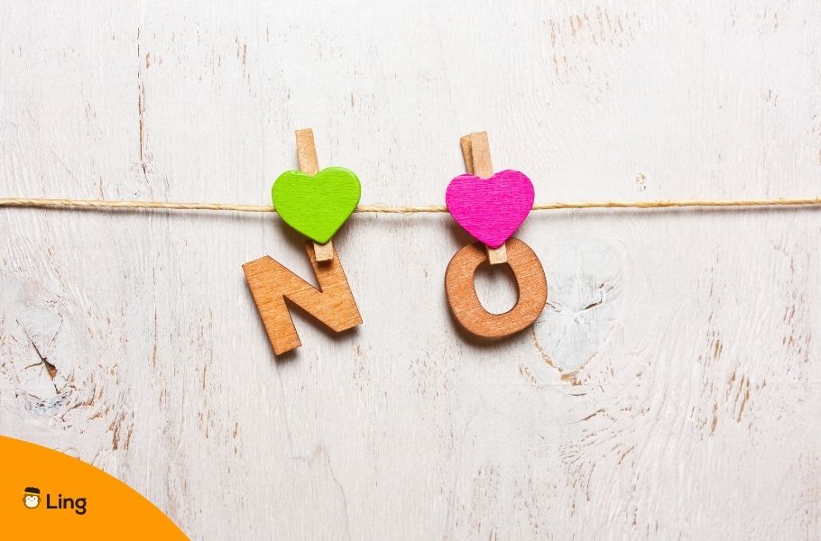 The Letters N And O Hanging From A Rope With Clothespins Forming The Word &Quot;No&Quot;