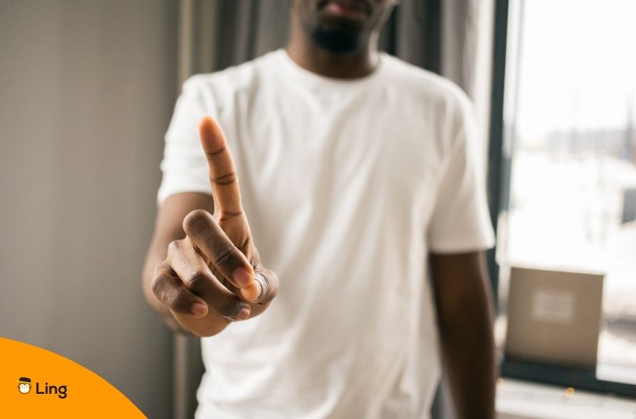 A Man Lifting His Hand And Wagging His Finger To Say No