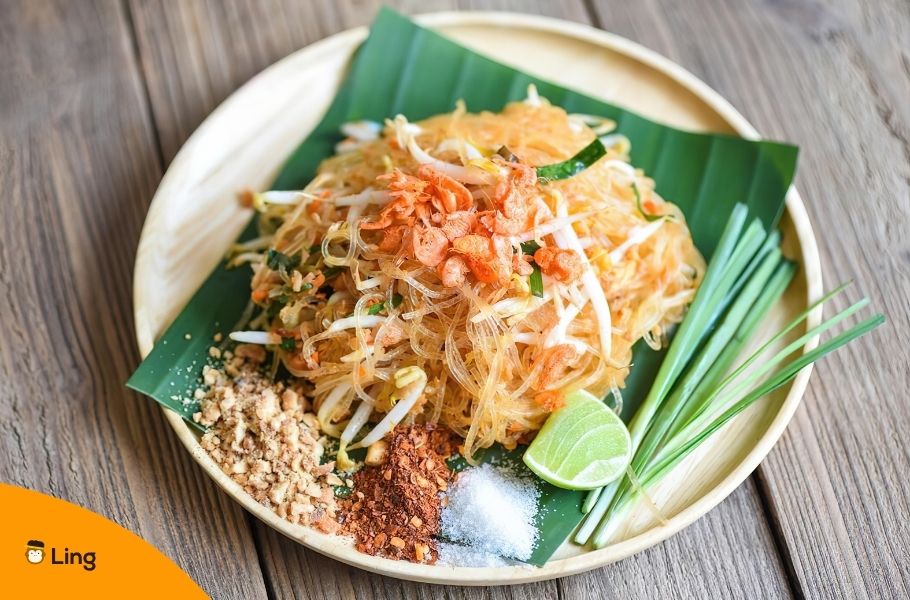 Plate Of Spicy Thai Chicken Pad Thai With Lime And Peanuts