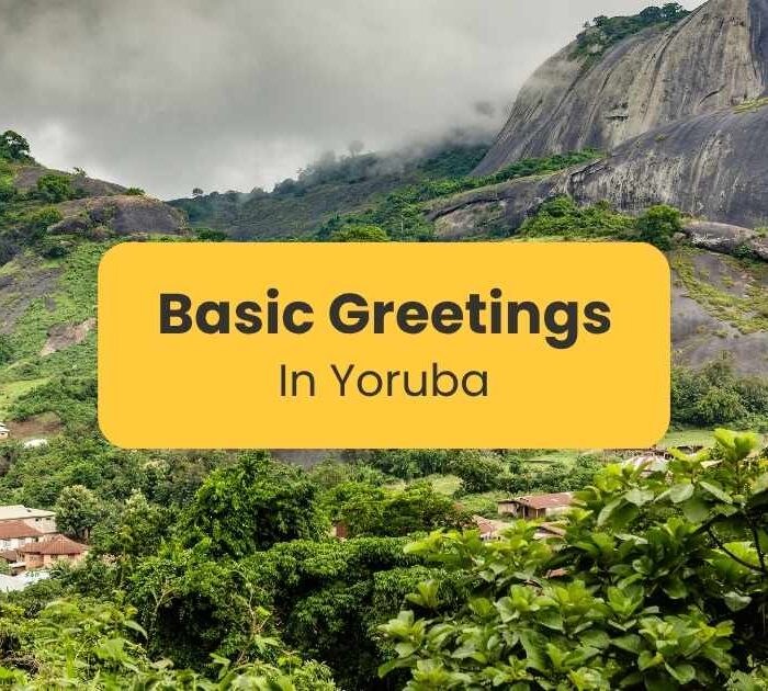 "Basic greetings in Yoruba" written on a yellow text box with an image of Idanre Hill, Nigeria as background