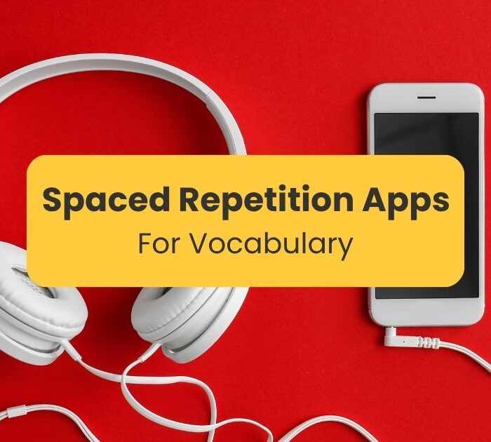 White phone and headphones on a red background - Best spaced repetition apps for vocabulary