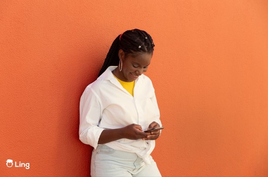Smiling Woman Learning A Language On Her Phone