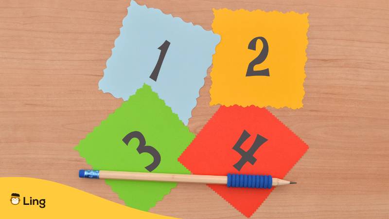 Holzfläche Worauf Bunte Blätter Mit Zahlen Und Ein Stift Liegen