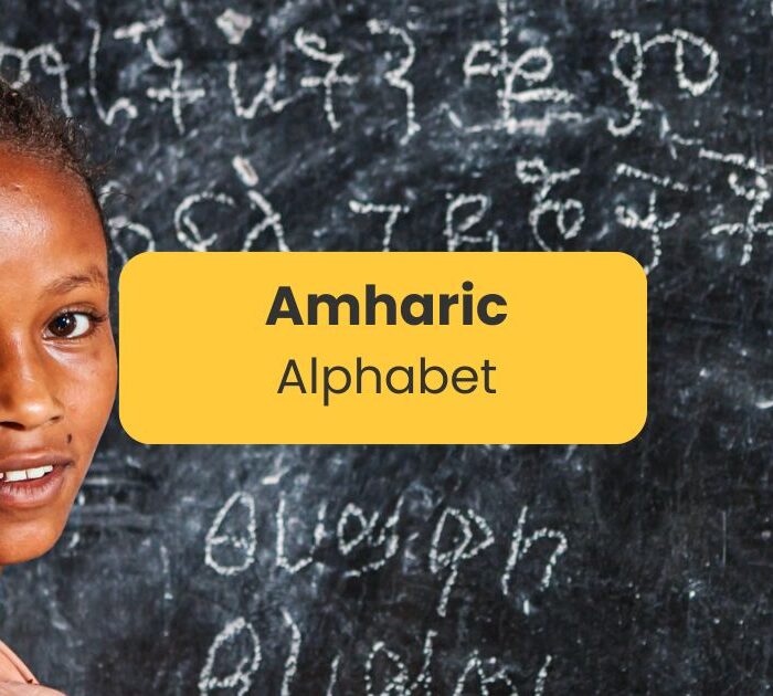 Amharic Alphabet - Kid writing on blackboard