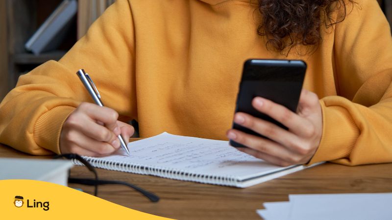 A Woman Learning A Language Through An App On Her Phone