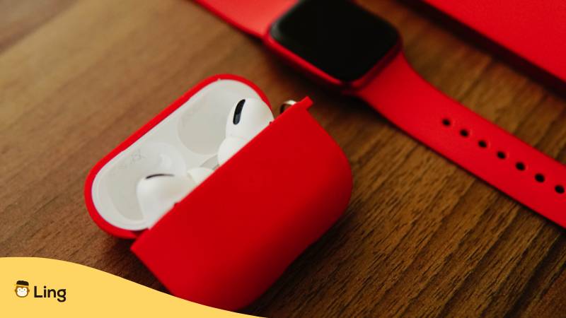 Smartwatch Und Hearpods In Der Farbe Rot