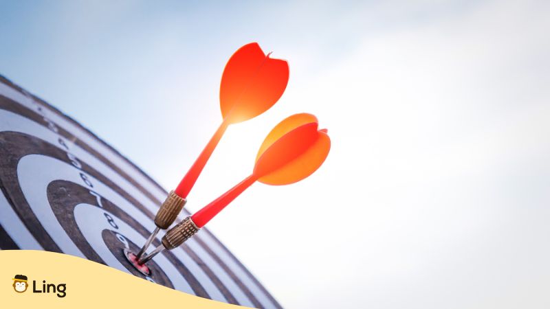 Objectif Noire Et Blanc Avec Des Fléchettes Rouges Symbolisant Un Objectif D'apprentissage D'une Langue