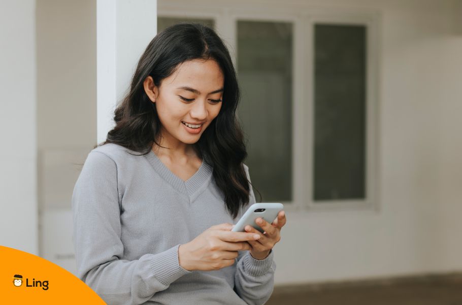 A Woman Learning A Language With An App On Her Phone