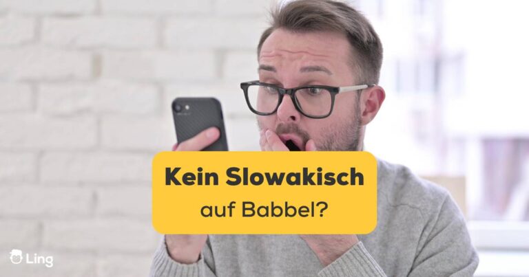Mann Mit Dunklem Brillenrahmen, Schaut Überrascht Auf Sein Mobiltelefon. Es Gibt Kein Slowakisch Auf Babbel. Entdecke Die 4 Besten Alternativen