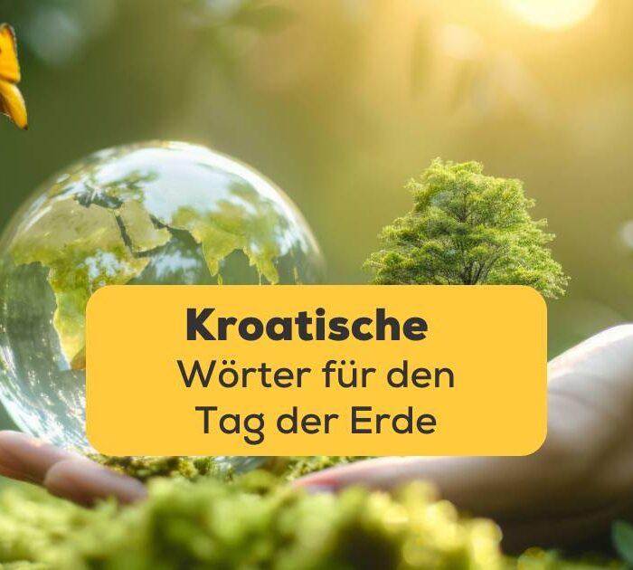 Händen hält er einen Globus. Im Hintergrund ist ein grüner Wald zu sehen. Entdecke in diesem Beitrag kroatische Wörter für den Tag der Erde