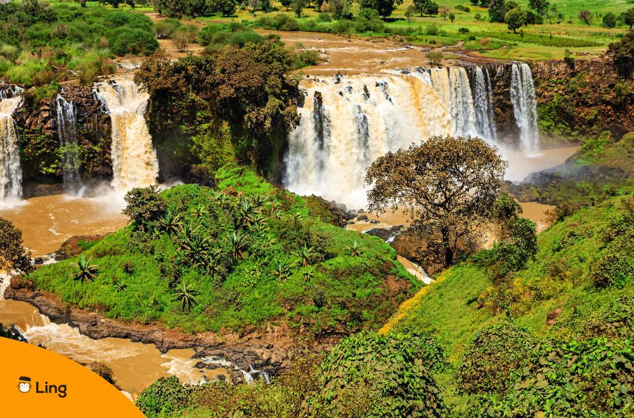 Wide Waterfall Flowing Through Green Highland Landscape In Ethiopia