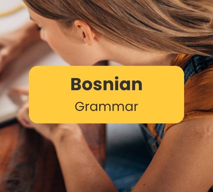 A woman learning Bosnian grammar step by step
