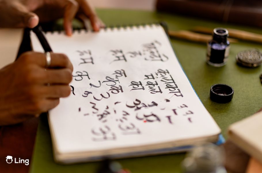 A Person Is Doing Calligraphy In Hindi