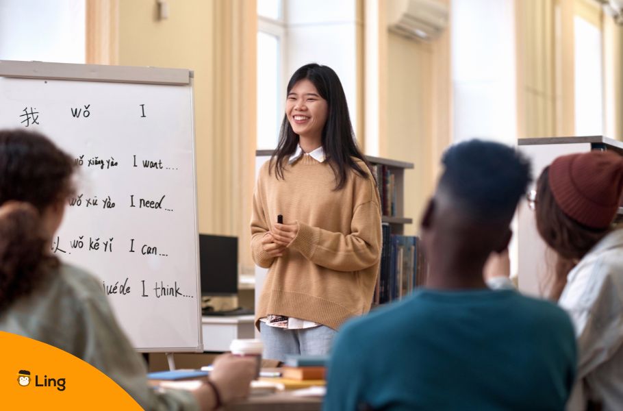 A Woman Teaching A Language In A Classroom