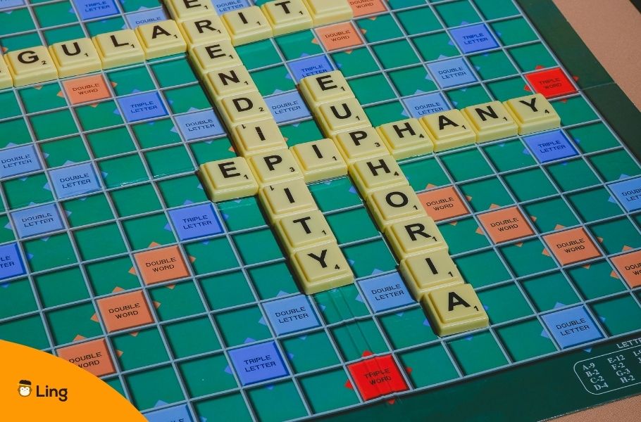 Scrabble Board With The Words Epiphany, Euphoria, Serendipity And Singularity Written With Tiles