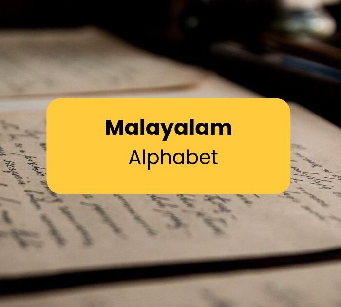Malayalam Alphabet - Writing in paper