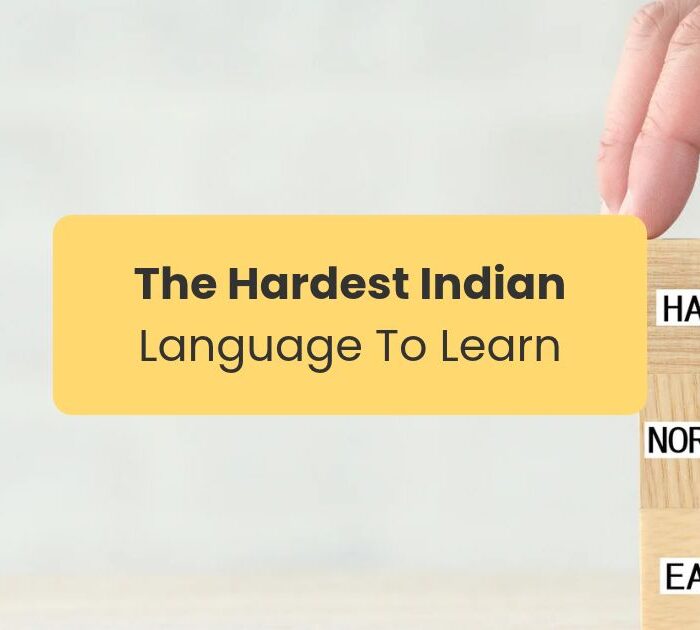 hardest indian language to learn A hand stacking small wooden square blogs on which it is written hard, medium and easy
